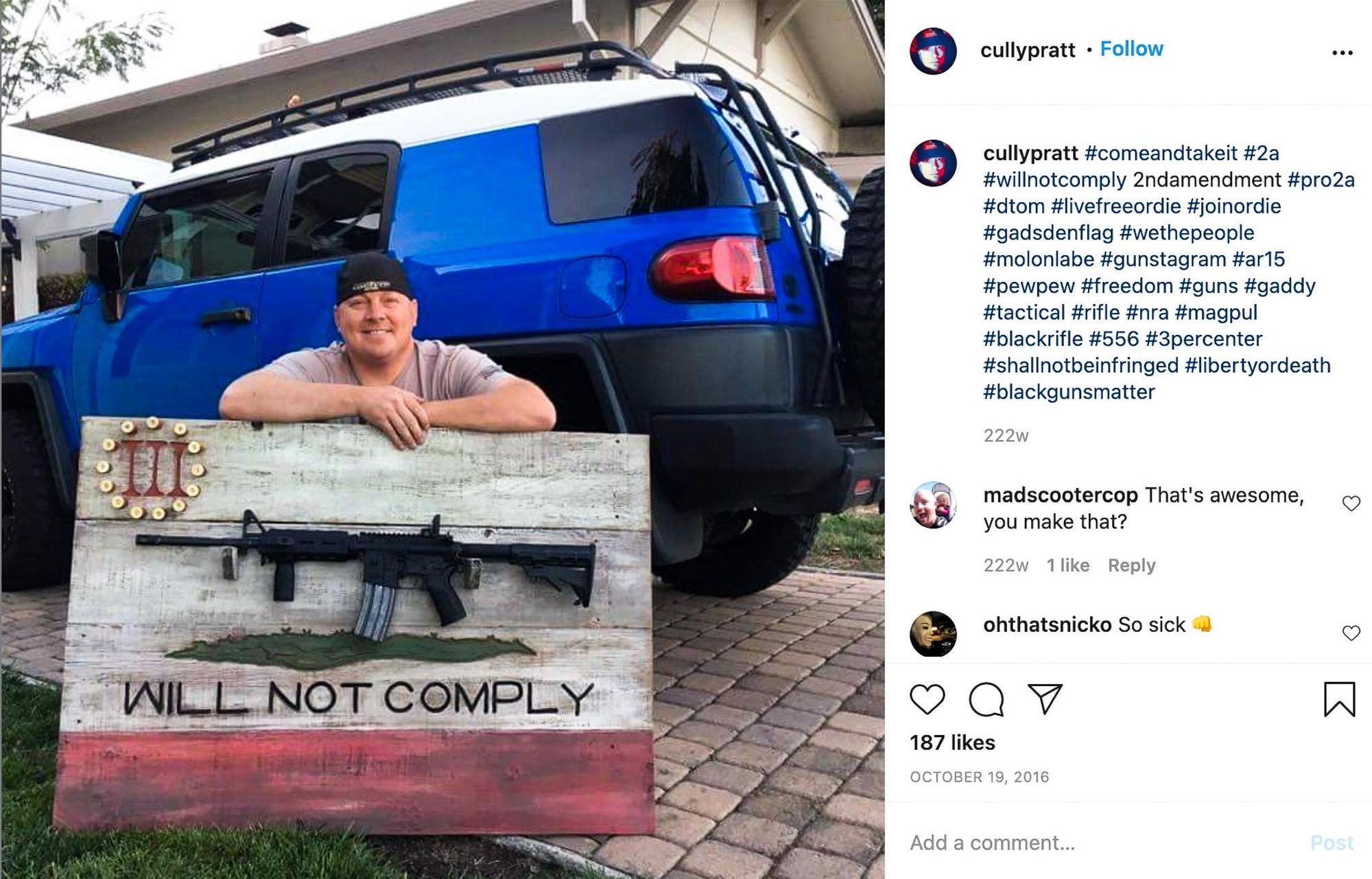  Sgt. Cully Pratt poses with a rifle display board 