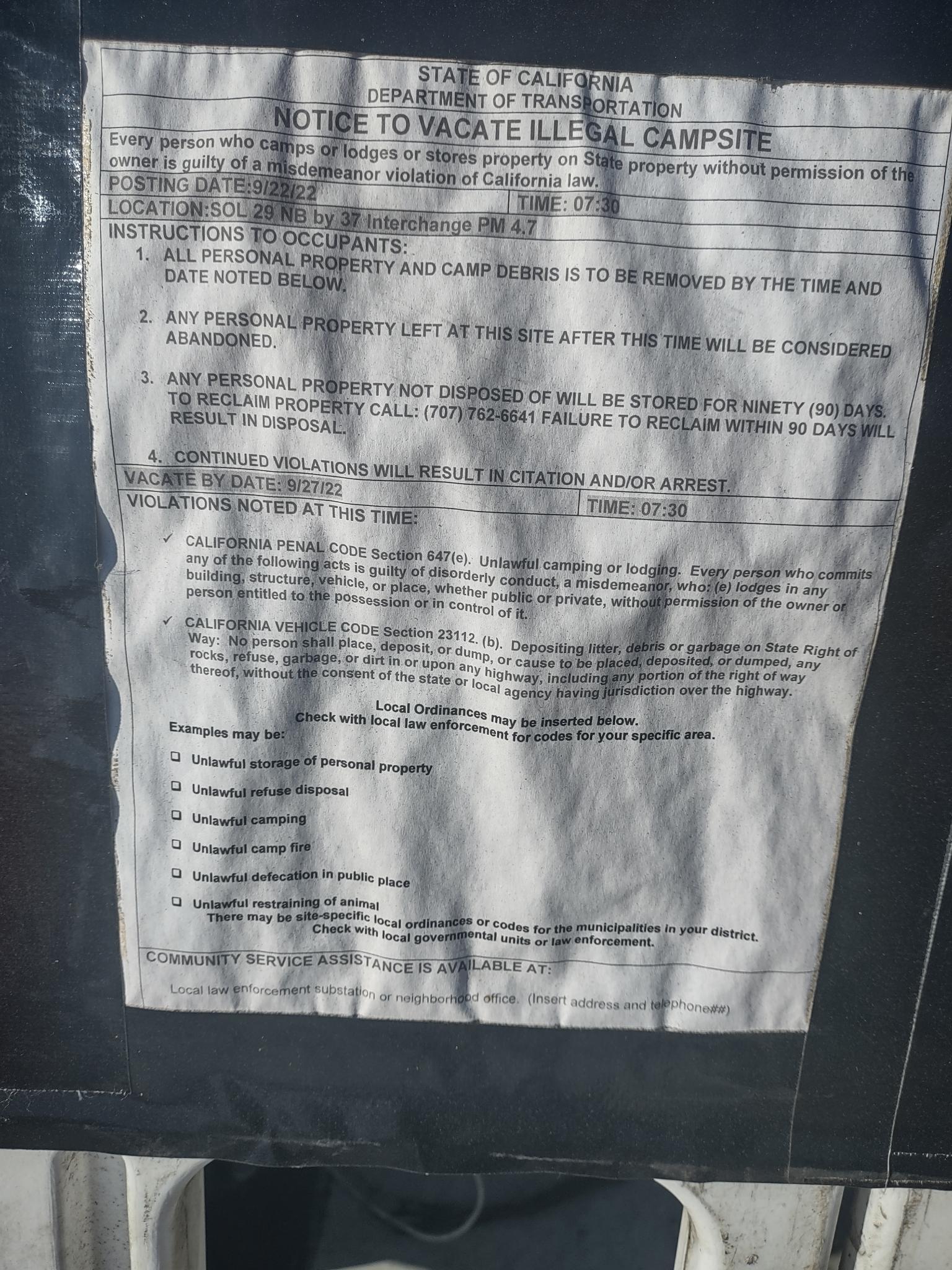 A notice of illegal campsite posted at the interchange of Highways 29 and 27.