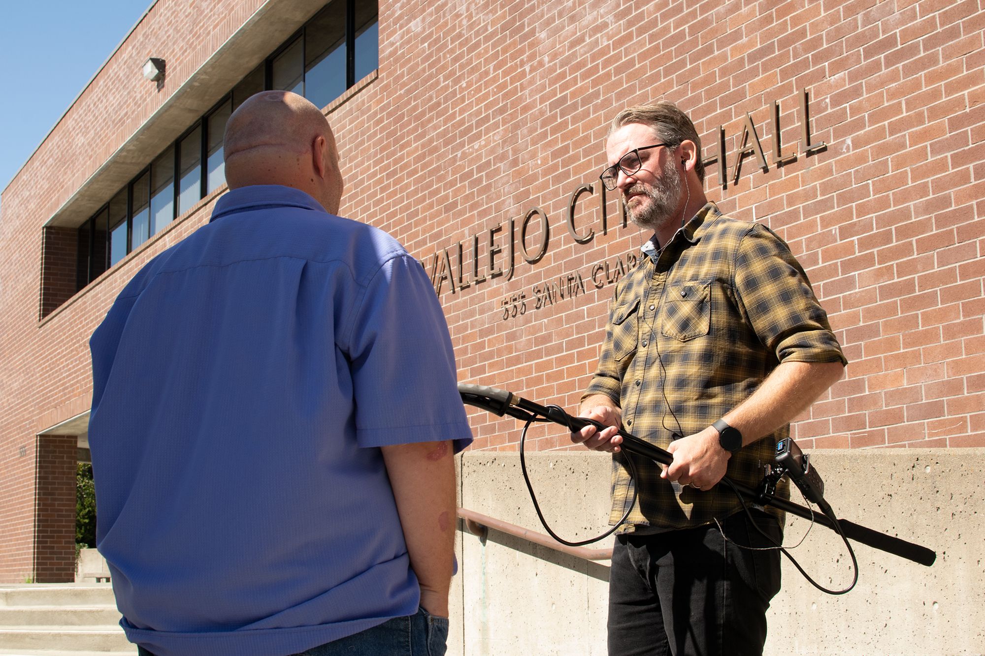 Vallejo Sun co-founder Brian Krans records an interview outside of Vallejo City Hall.