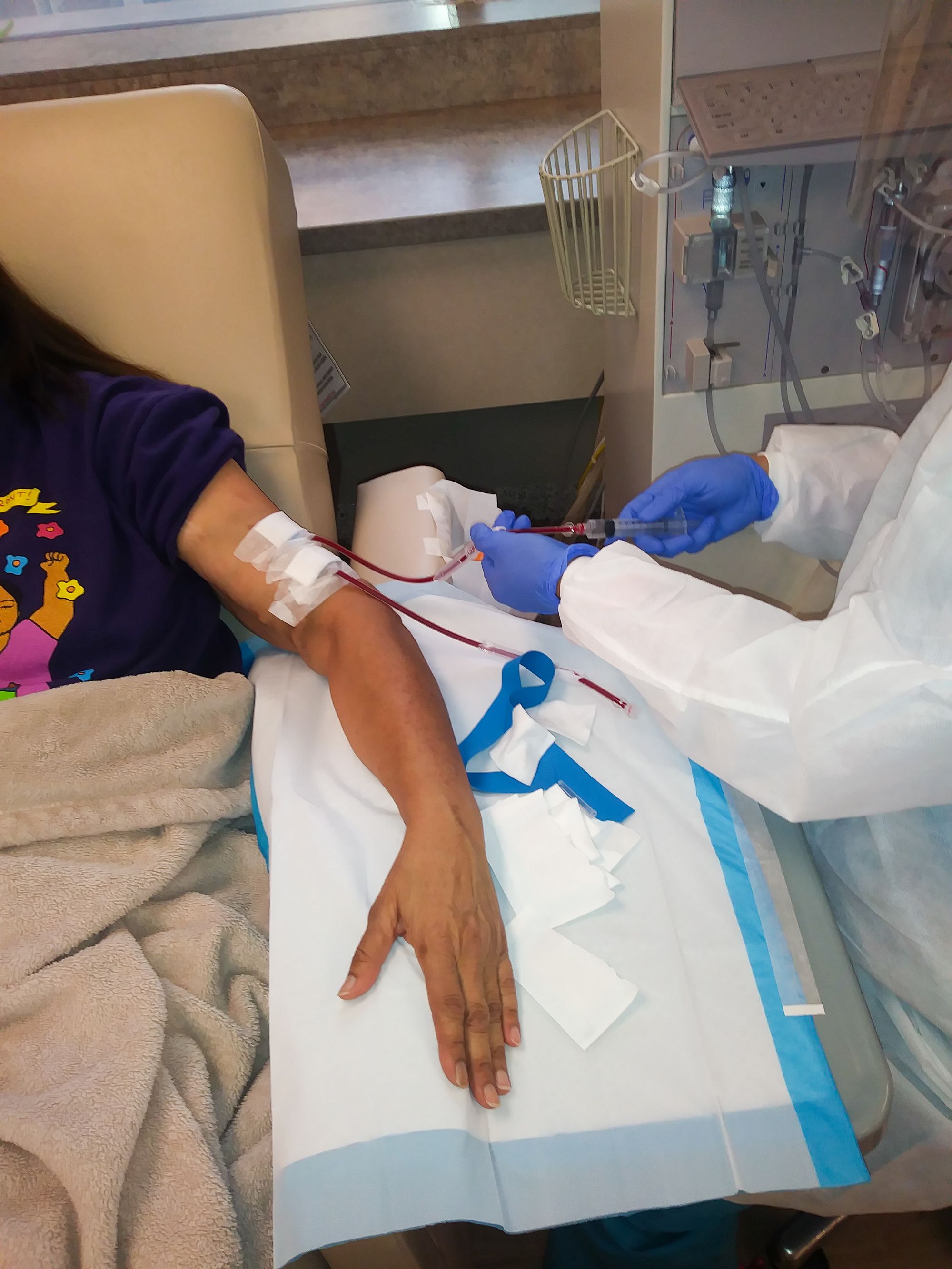 A patient receiving dialysis treatment. 