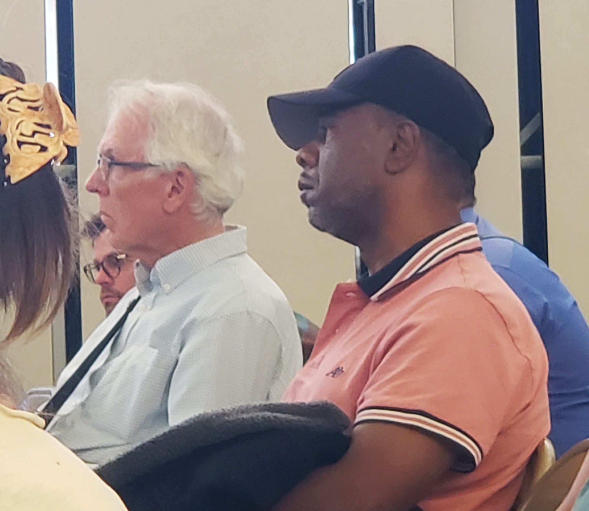 Jamazea Kittell's father Reggie Kittell listens during a town hall meeting Wednesday.