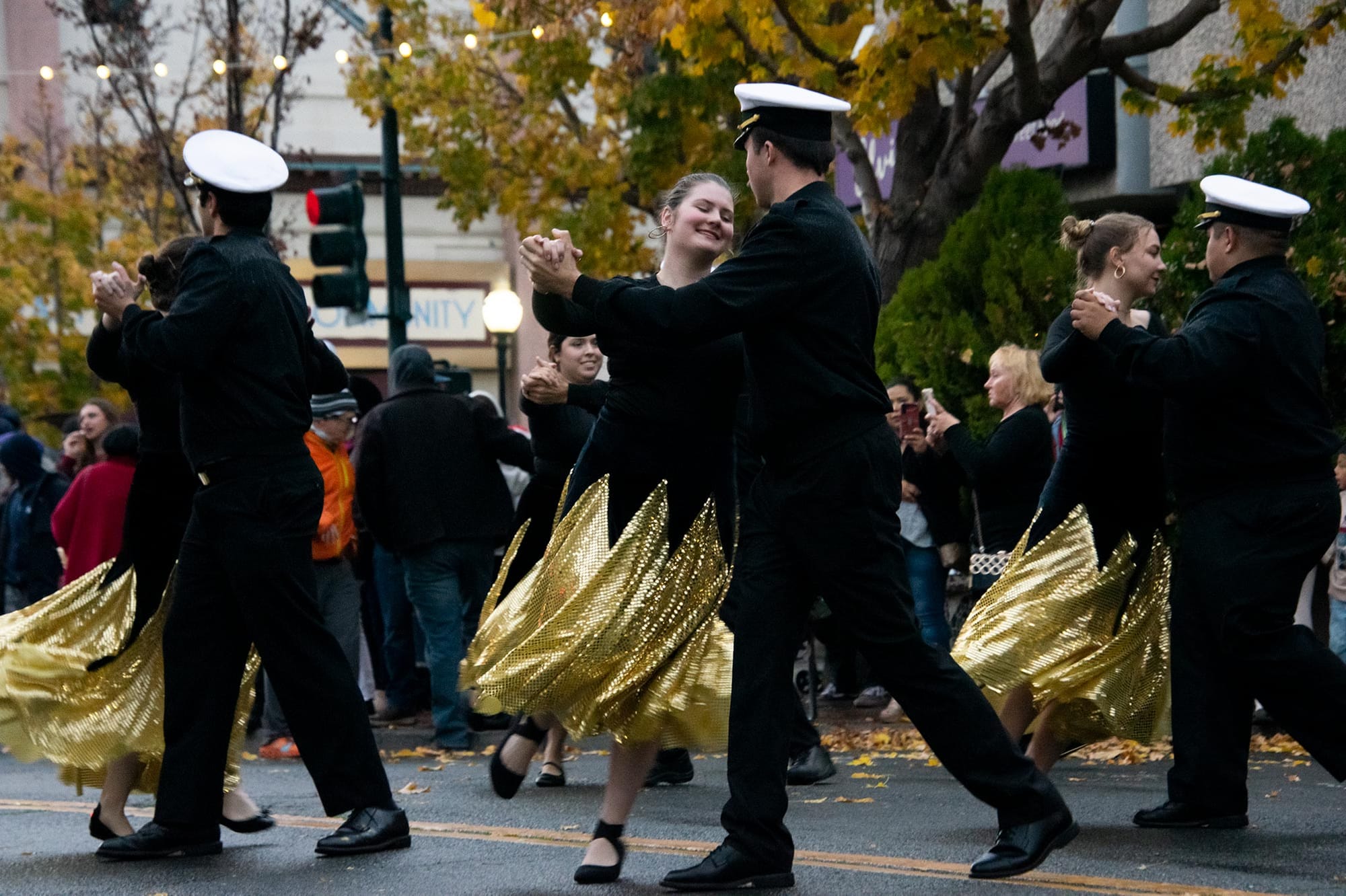 Cadets from California State University Maritime Academy partner danced in the streets during Vallejo's Mad Hatter parade.