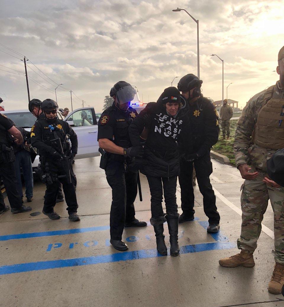 A protester arrested at Travis Air Force Base on Thursday. 