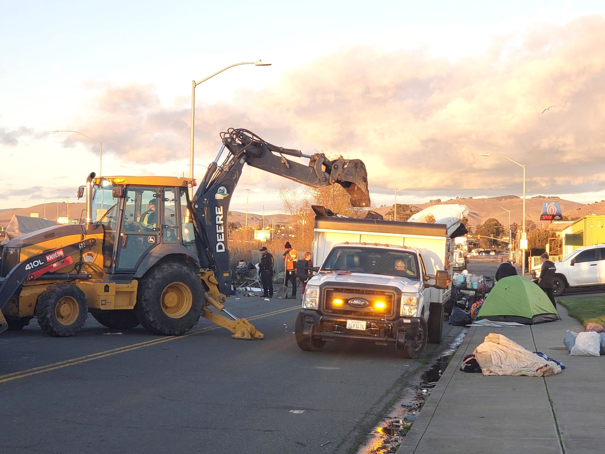 Vallejo city workers used large trucks and a hydraulic loader to clear an encampment on Enterprise Street on Wednesday. 