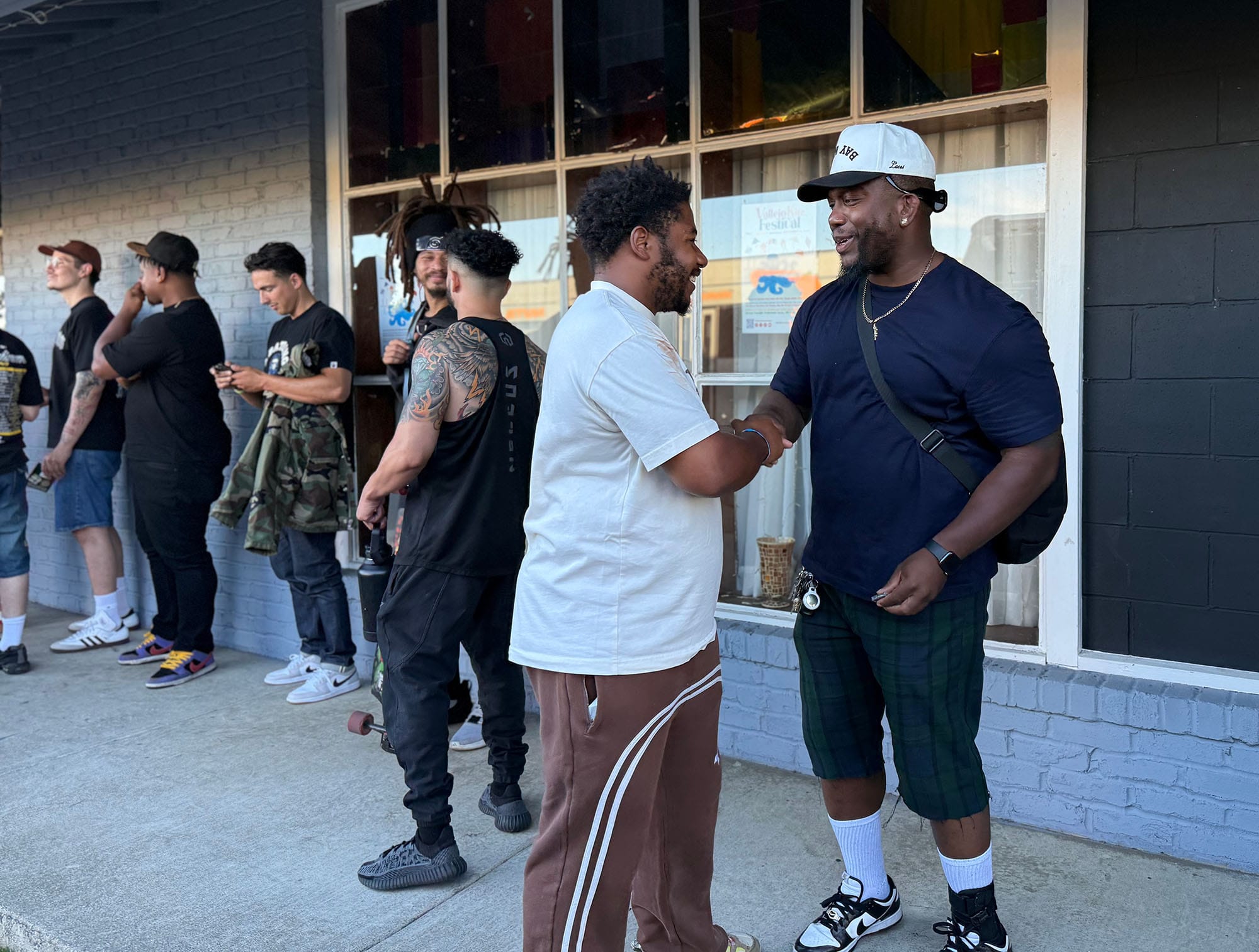 LaRussell and Frank Alvin shake hands