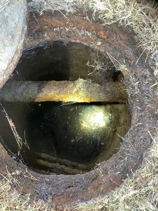 A maintenance hole on Mare Island with severe corrosion around the rim