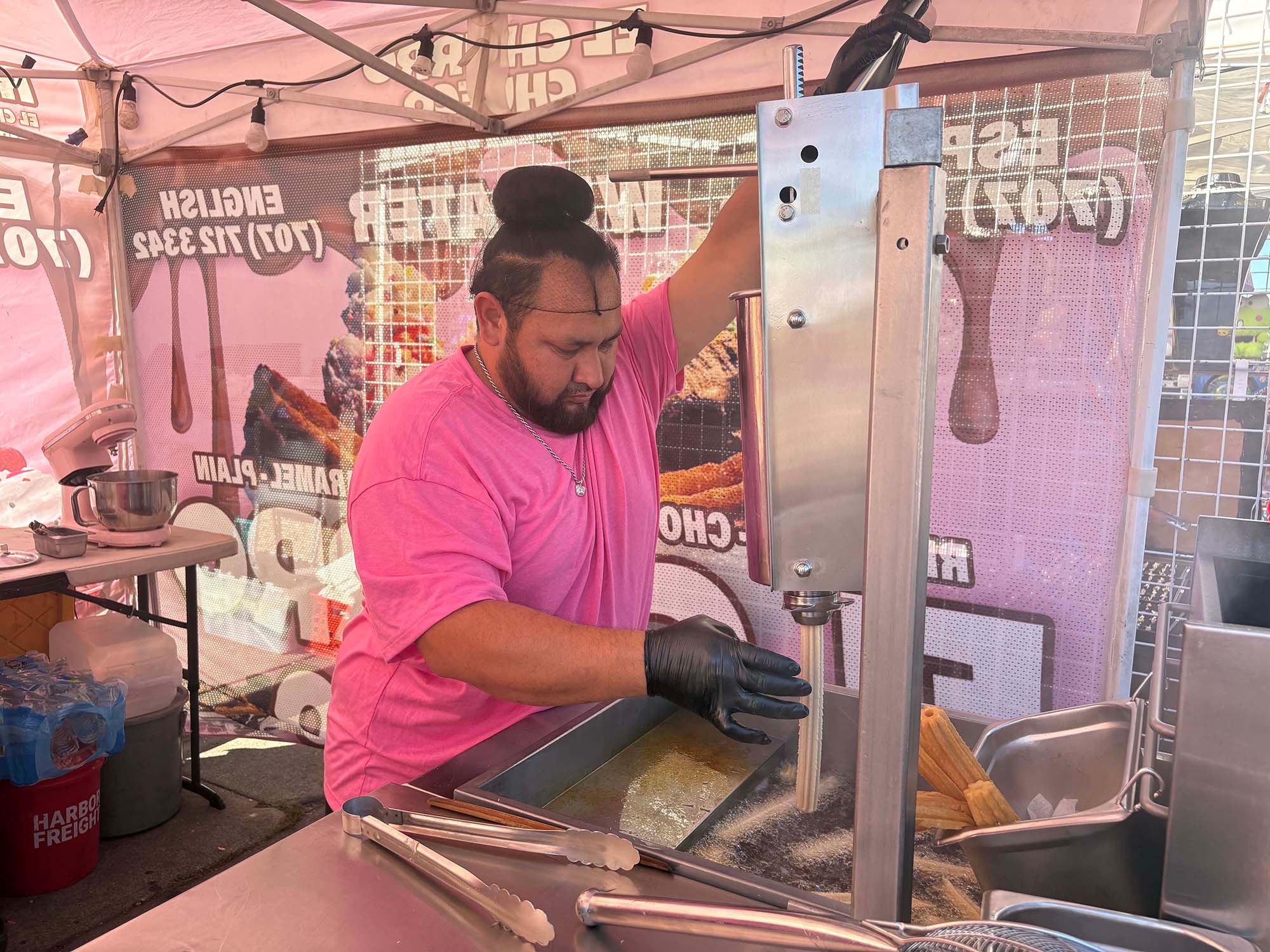 Juan Mejia prepares a batch of churros for customers in Vallejo. 