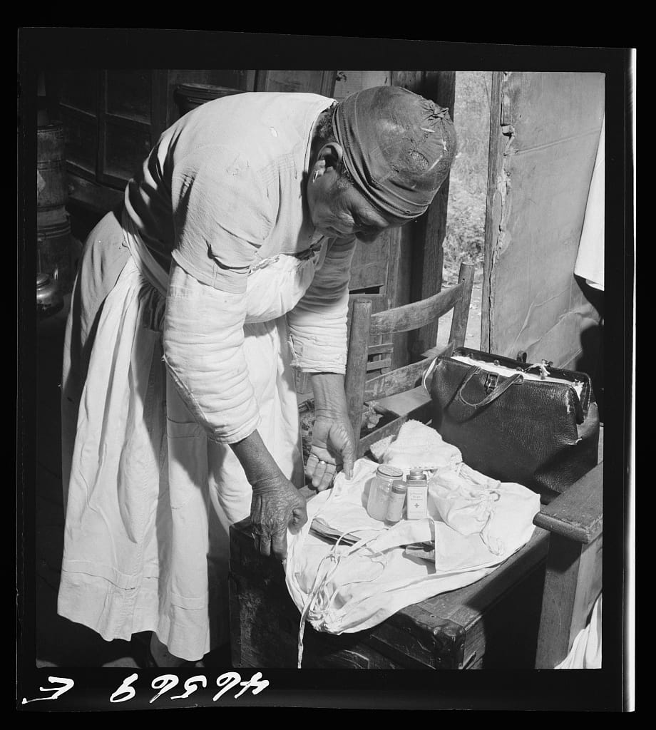 A midwife wrapping her kit to go on a call in Greene County, Georgia, on Jan. 1, 1941.