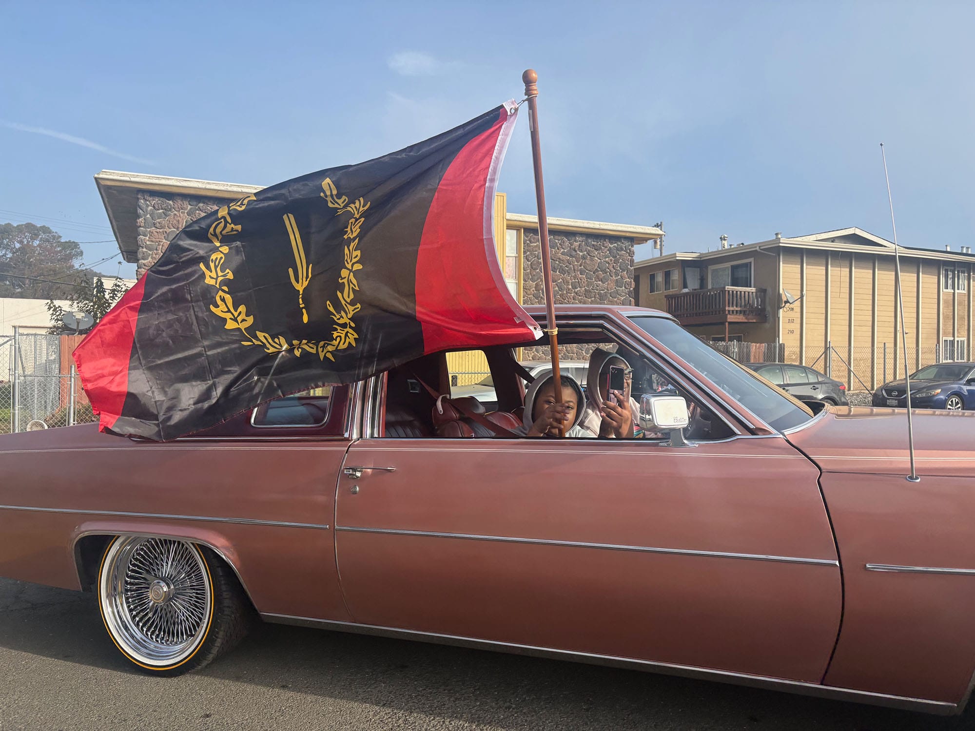 Vallejo residents fly a Black American Heritage flag as part of the Martin Luther King Jr. Day march on Jan. 19. 