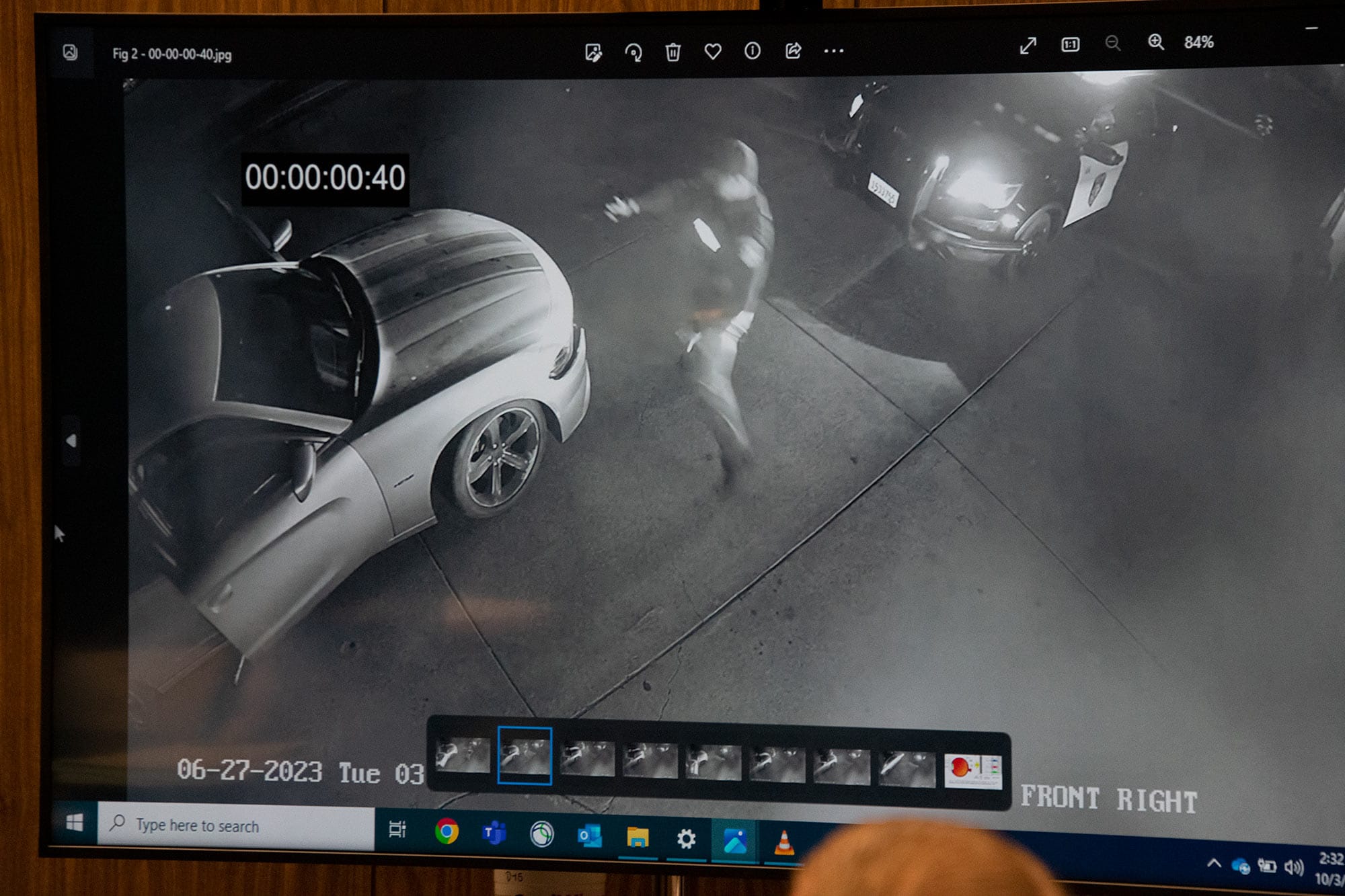 A still from surveillance video shown in court shows that Jamazea Kittell had already started moving away from Officer Brad Kim before Kim crossed in front of his vehicle
