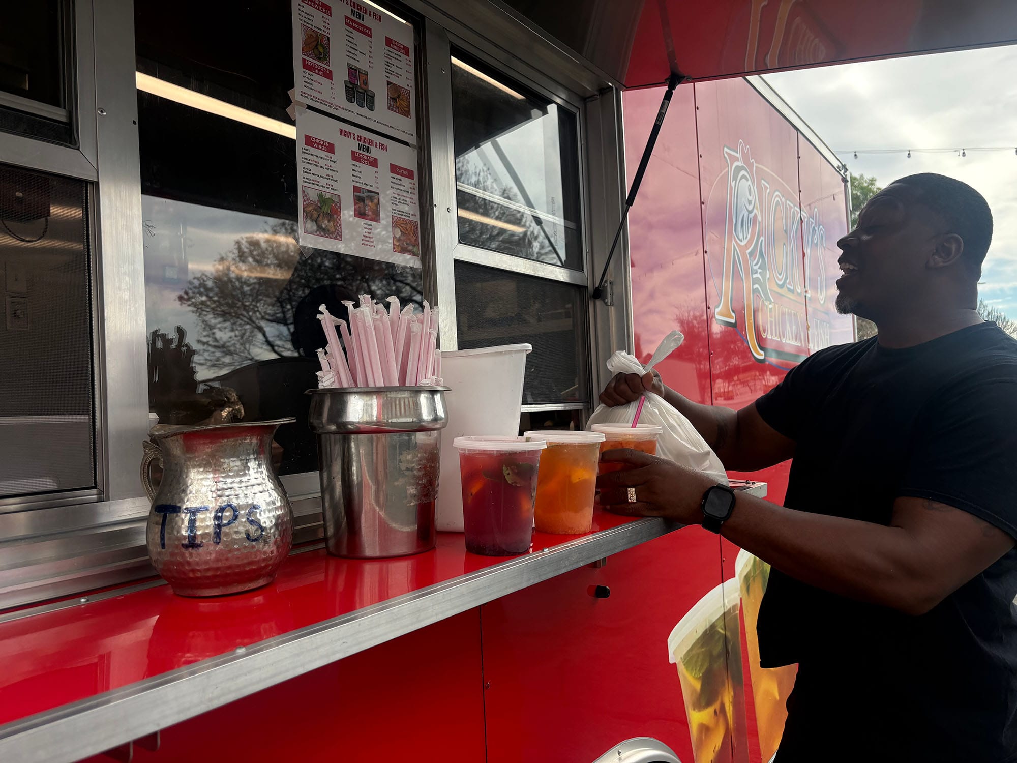 Vallejo resident Ed Davis picks up his order from Ricky's Chicken and Fish